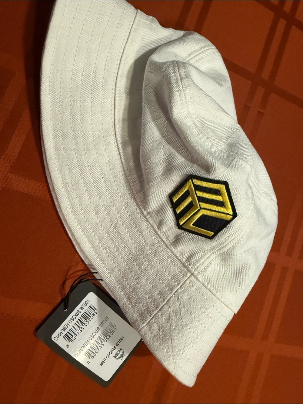 MCM White Cotton Bucket Hat with Black & Yellow Geometric Patch